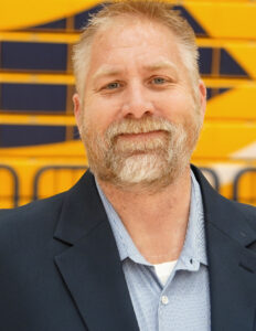 Headshot of General Manager Steve Kirk in front of the bleachers at The Sonnentag Centers at the UWEC