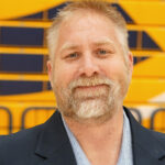 Headshot of General Manager Steve Kirk in front of the bleachers at The Sonnentag Centers at the UWEC