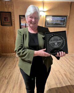 Cindi Tscherne receiving the Marshall Acknowledgement of Rexcellence Award at the 2025 Marshall Rec Awards, honoring her leadership and legacy.