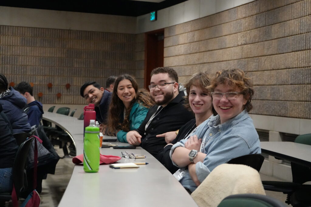 Gen Z students at DePaul University sit at table at The Ray