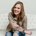 CENTERS' Taylor Carlson casually sits on sofa