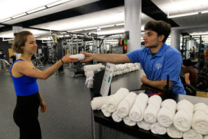 Customer service interaction at a CENTERS managed campus recreation facility at DePaul University.