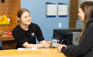 Customer service interaction at a CENTERS managed campus recreation facility at Harper College.