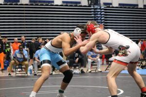 Two high school wrestlers competing at The Sonnentag during the Husky Wrestling Invitational