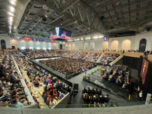 Graduation ceremony at the Joan Perry Brock Center, showcasing community use of a collegiate arena.