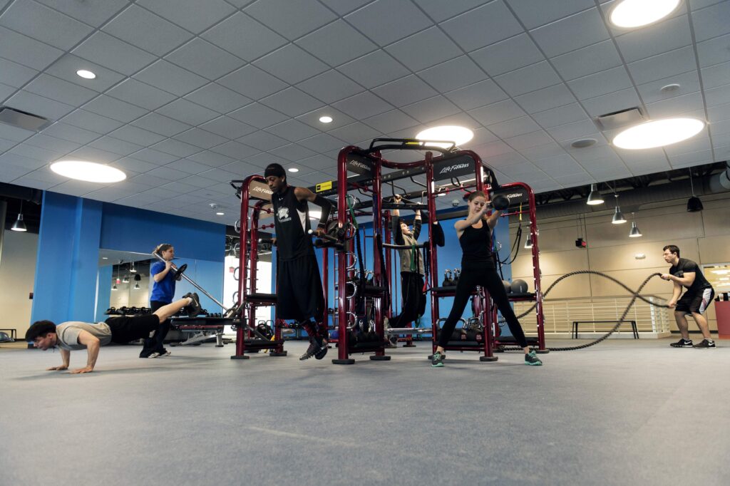 Students using free weights and strength equipment at DePaul University’s recreation center.