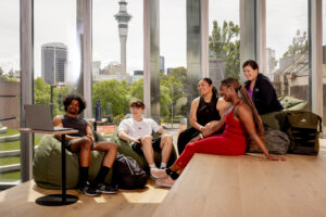 Students relaxing in a cozy lounge space inside HIWA Recreation Centre.