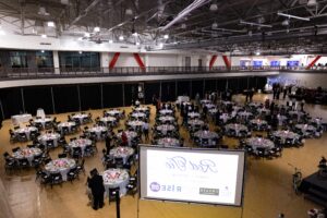 Elegant banquet table setup for the Jacksonville State Red Tie Gala inside the campus recreation center