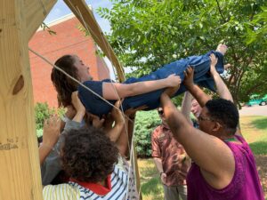 University of Alabama at Birmingham leaders participate in a team building ropes course, highlighting collaboration and people-focused leadership