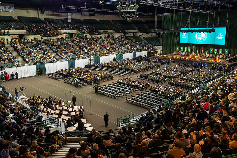 Cleveland State University graduates and guests gather for commencement inside the Wolstein Center.