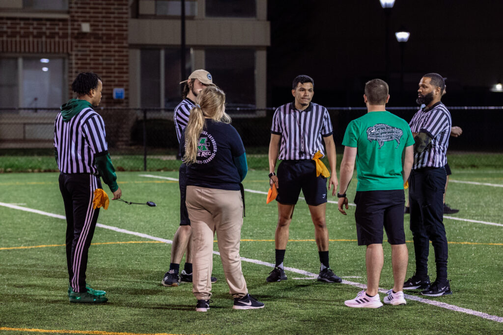 Marshall Recreation employees build leadership and communication skills while discussing field operations with officials.