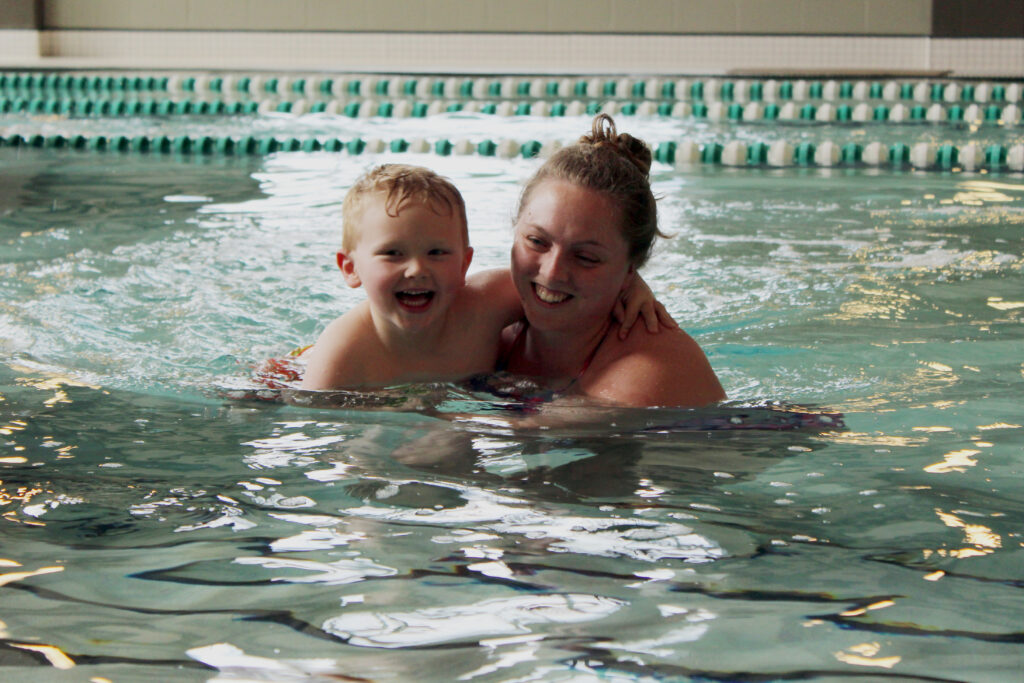 Sarah McGlumphy gives swim lessons to local youth.