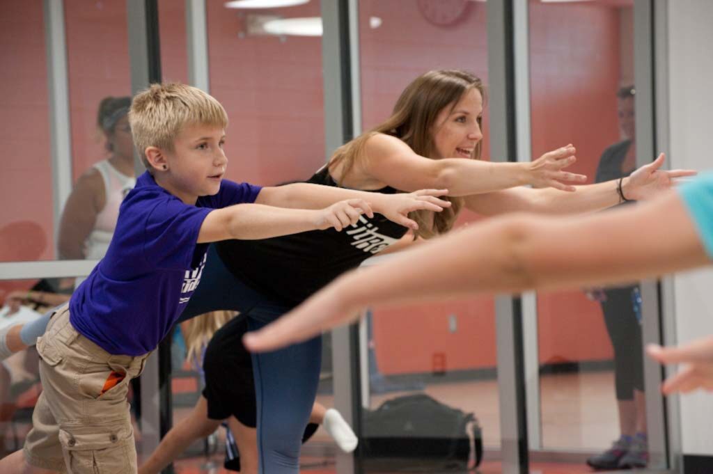Erin Stevenson leads children through yoga during one of MVCC’s college summer camps.